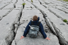 Sheshymore Limestone pavement exposes shallow water carbonates of the Brigantian, Slievenaglasha Formation. These classic kharstified exposures of tabular blocks of limestone pavement, Clints, are cut by vertical fractures, Grikes, which were widened by post glacial disolution (McNamara, & Hennessy, 2010). Fractures were intially established during Variscan folding (Coller, 1984).